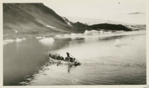 Image of Eskimos [Inughuit] and dogs going ashore